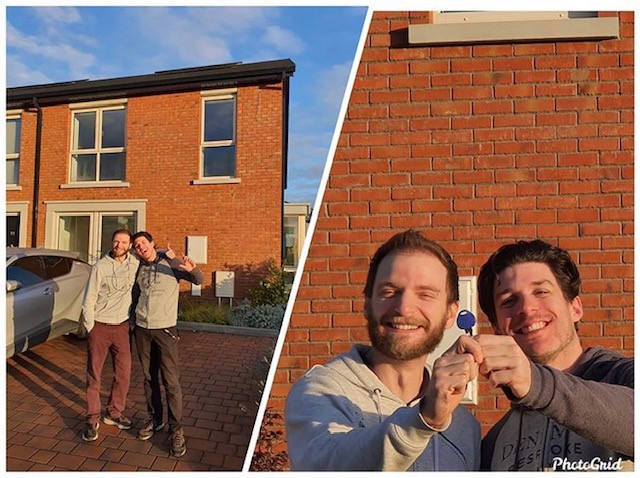 Two friends celebrating new home ownership outside